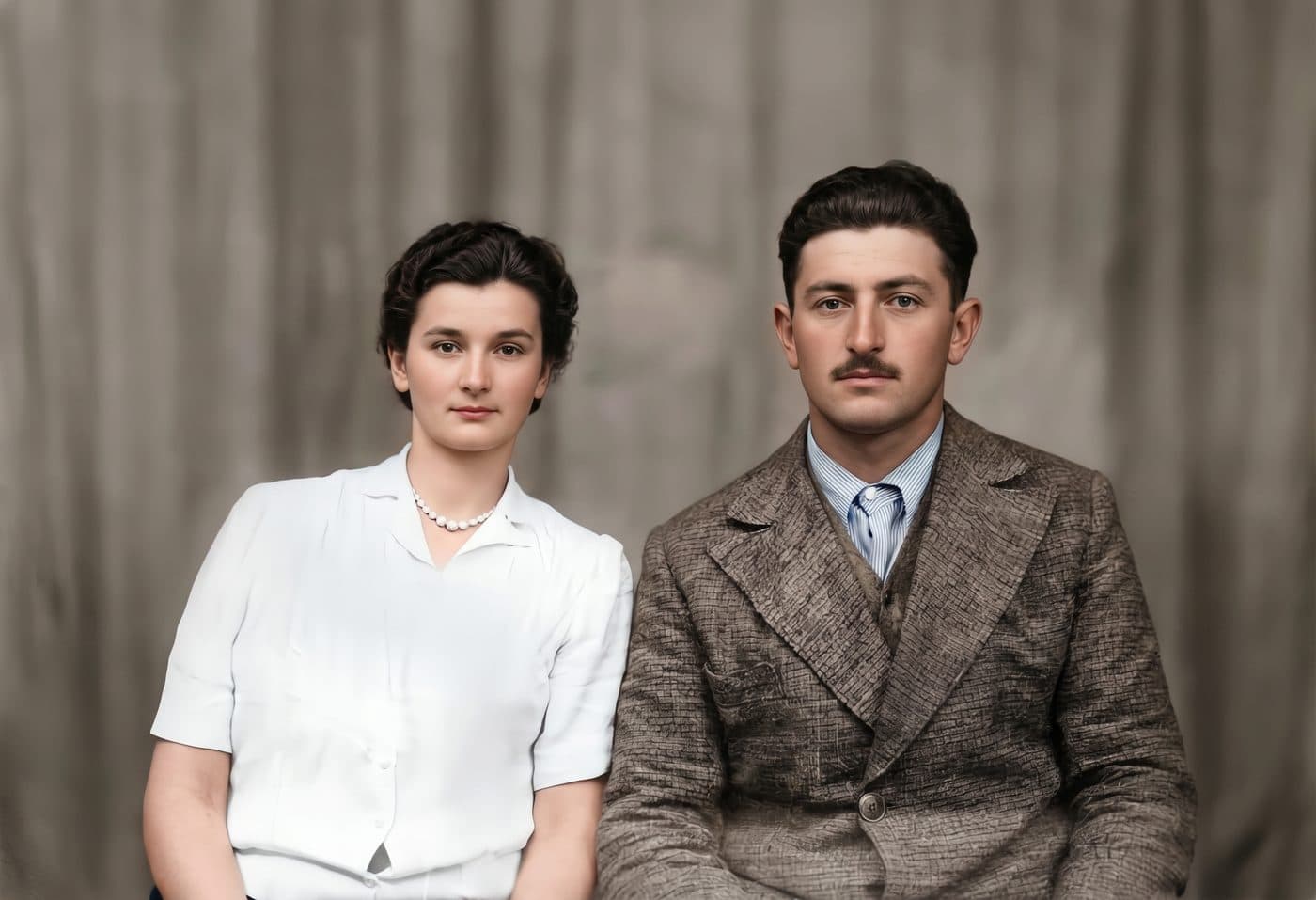 A young couple on a cracked and peeling glass-plate negative, restored and colorized